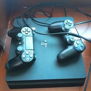 Sony Black PlayStation 4 Console with Two Black DualShock Controllers